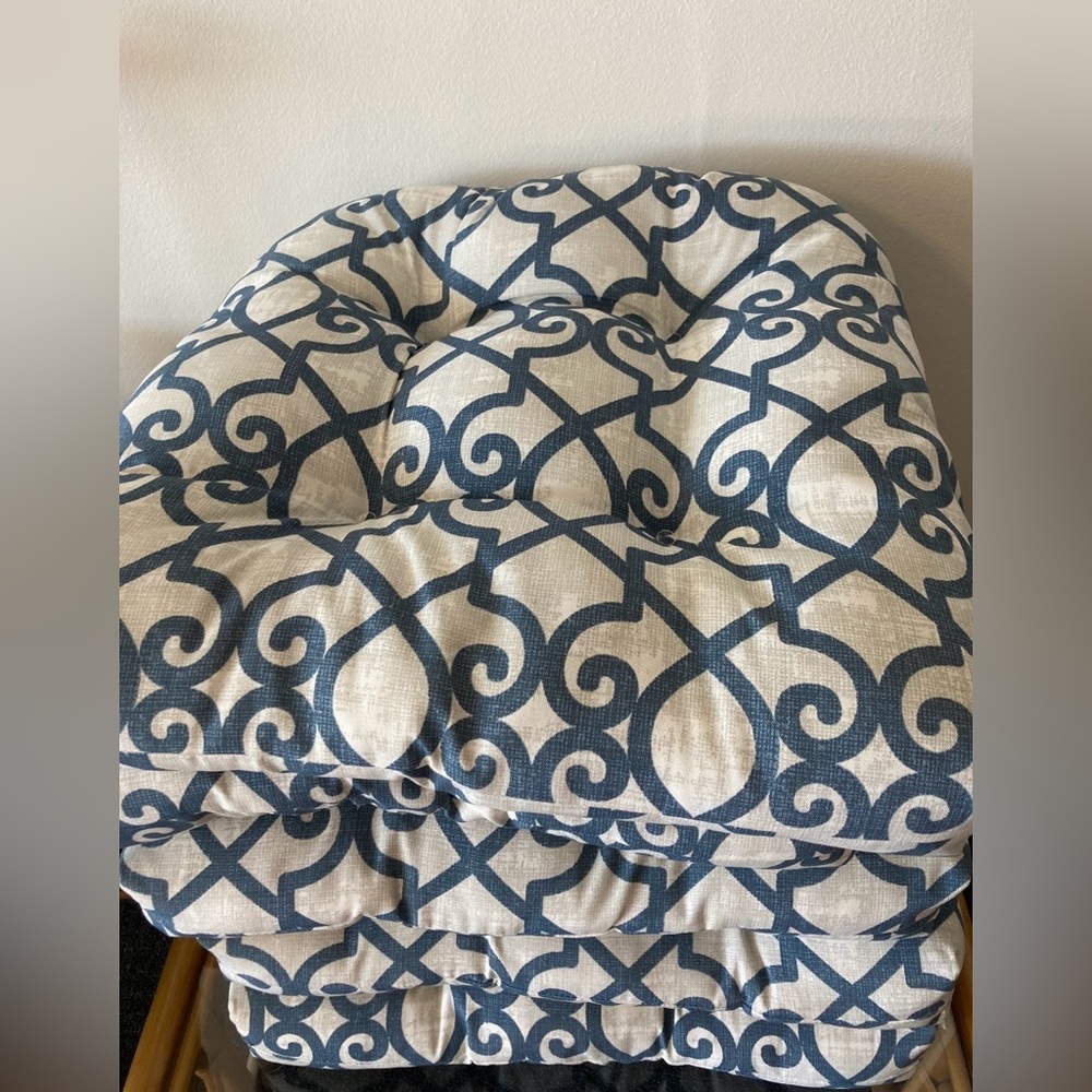 Six blue patterned patio cushions